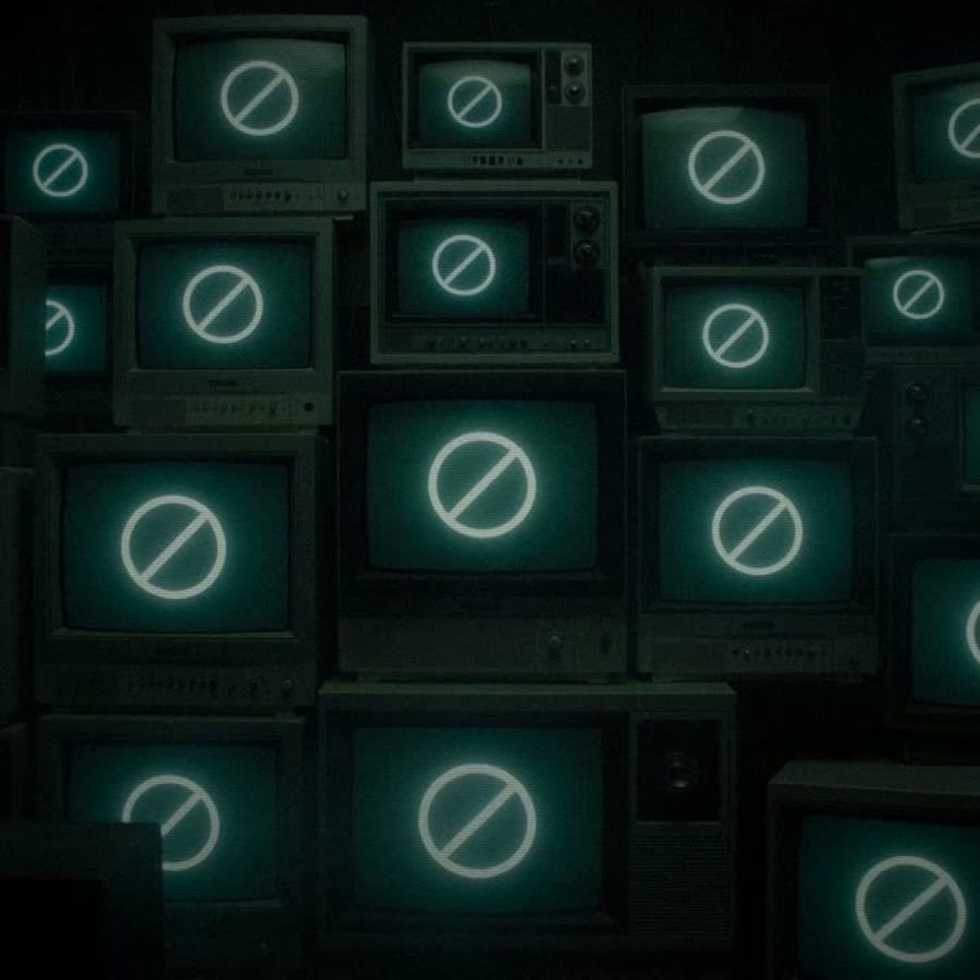 A wall of old CRT televisions, each showing the Null-Circuit null symbol